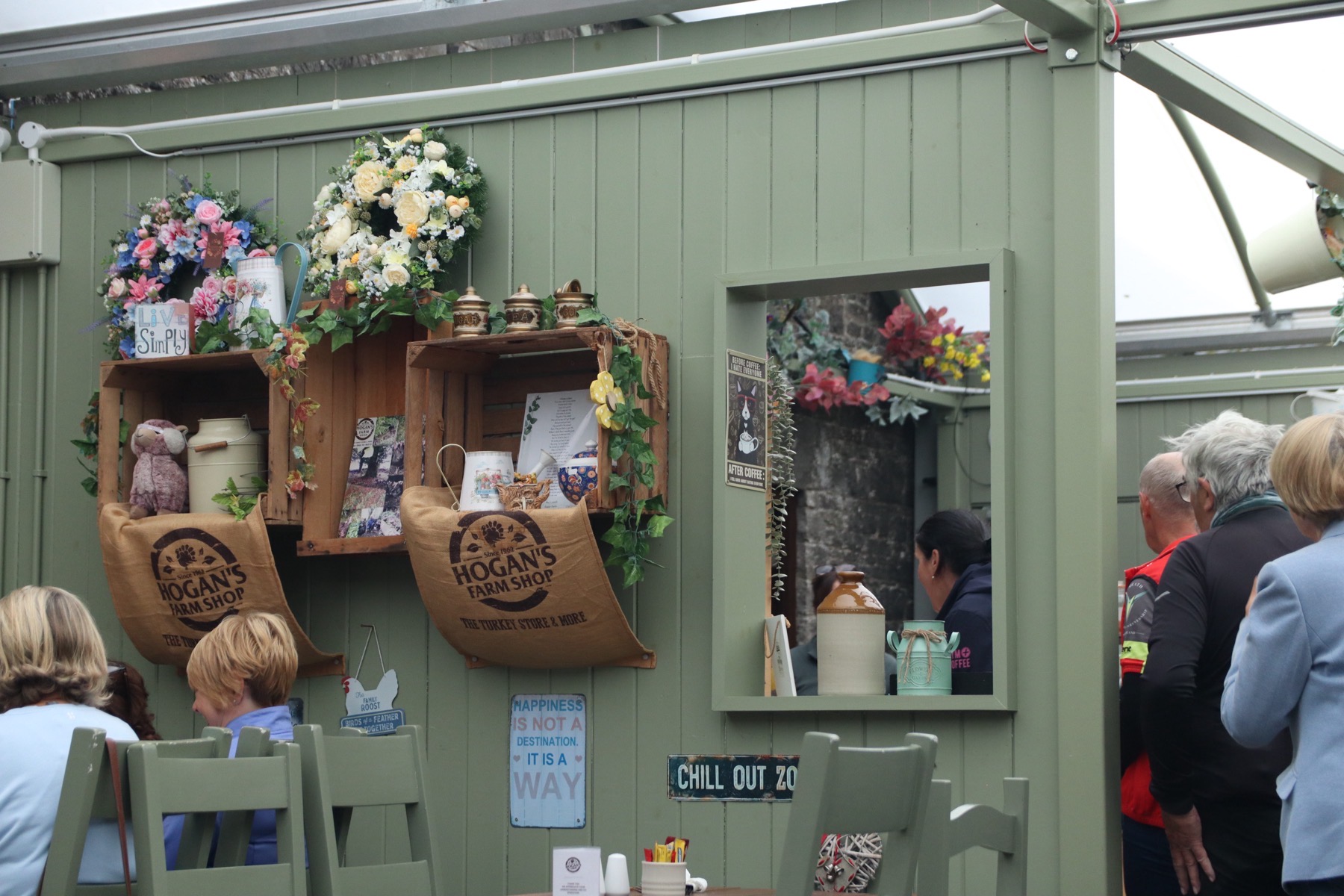 Inside Hogan's Farm Shop, with branded hessian displays and seating